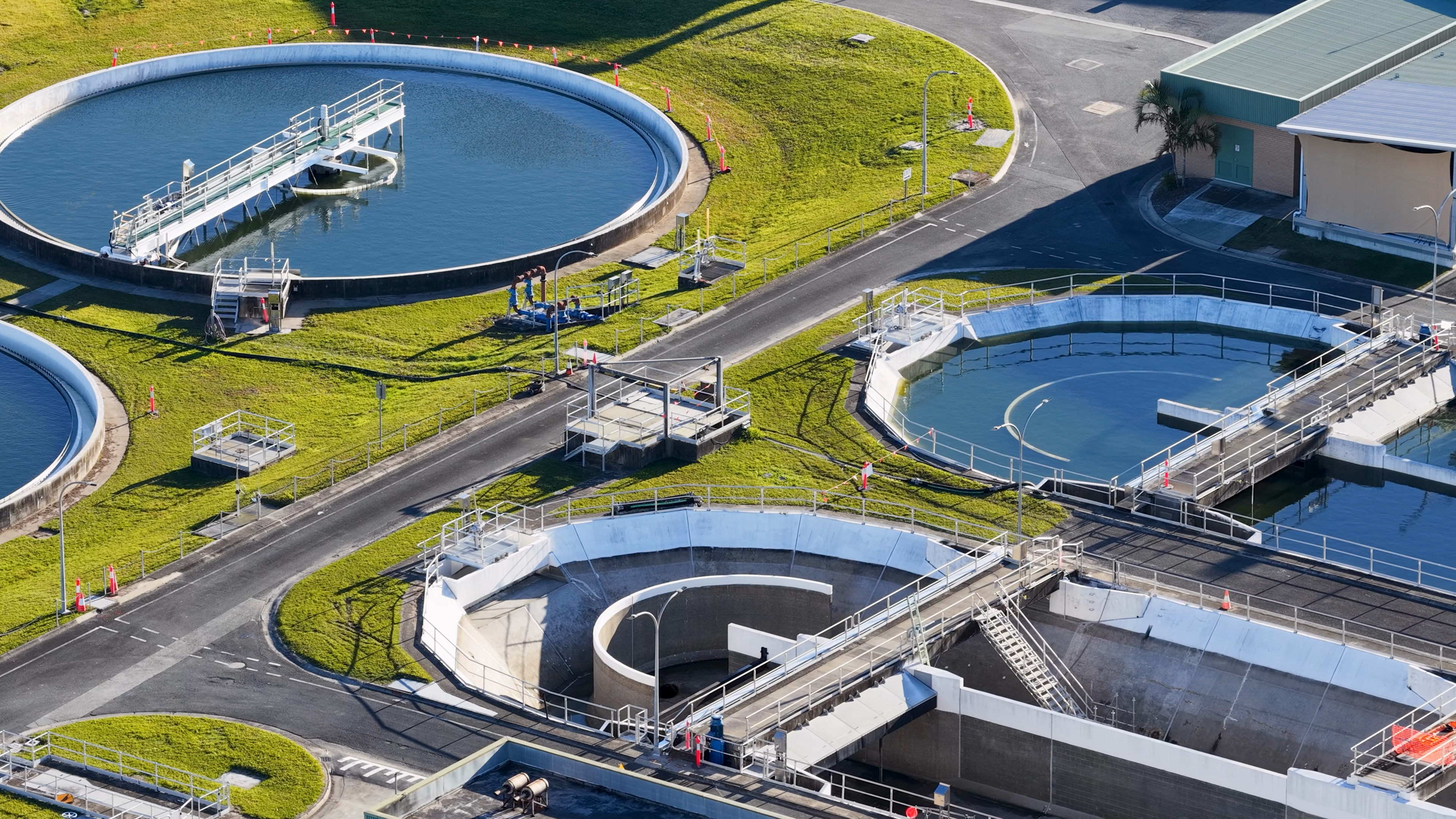 Aerial view of circular settling tanks at a treatment plant